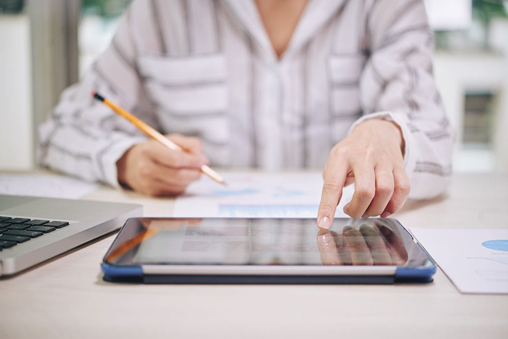 woman-using-tablet-while-working