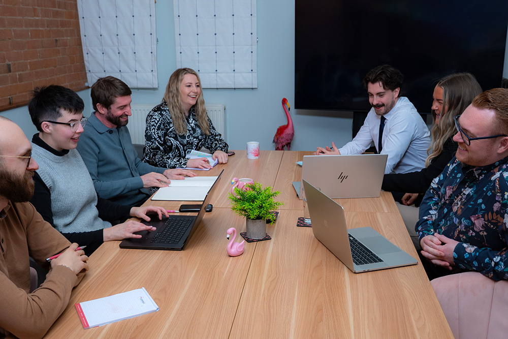Flamingo Team Around Table