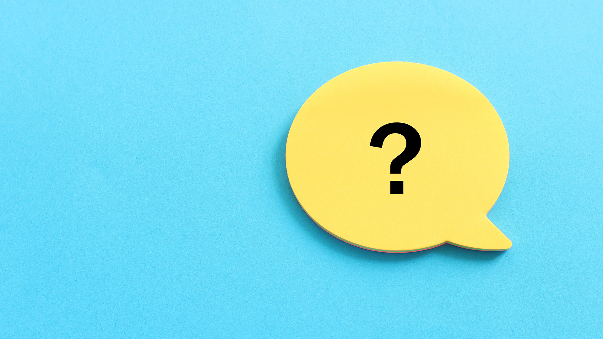 Question mark in a yellow speech bubble on a blue background